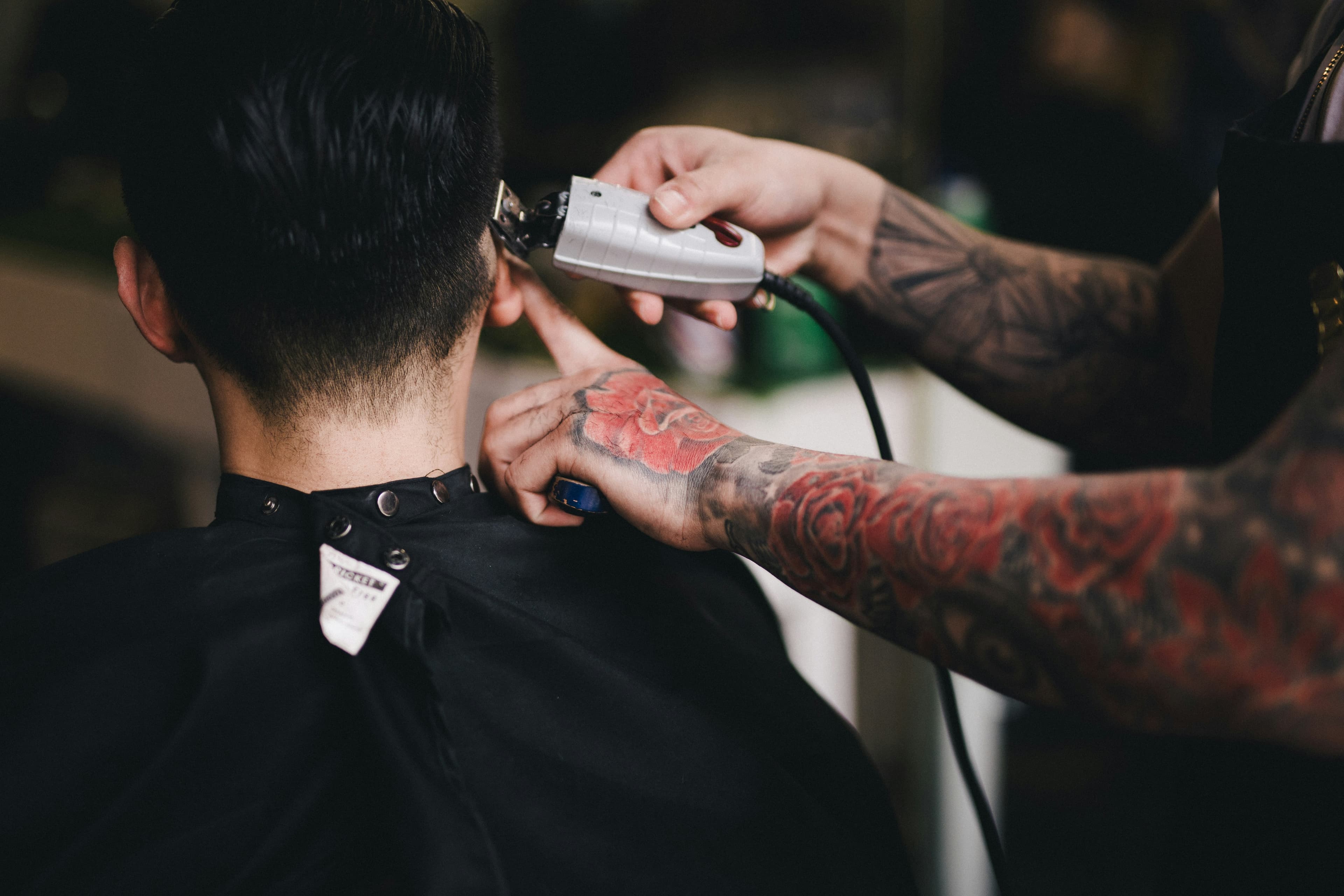 Barber creating a fade haircut
